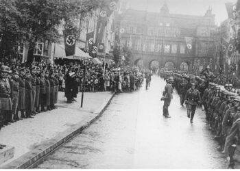 German folk band sings songs of Wehrmacht in a city where WWII began