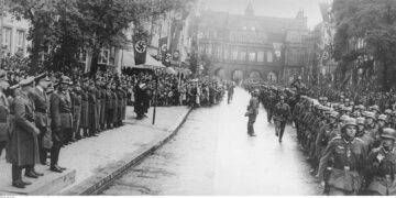 German folk band sings songs of Wehrmacht in a city where WWII began