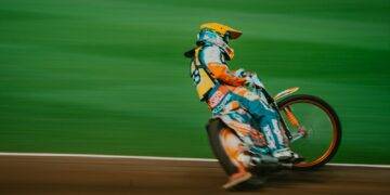 man riding motocross bike on panning photography