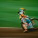 man riding motocross bike on panning photography