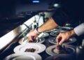 person preparing cooked dish