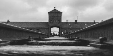 grayscale photo of concrete bridge