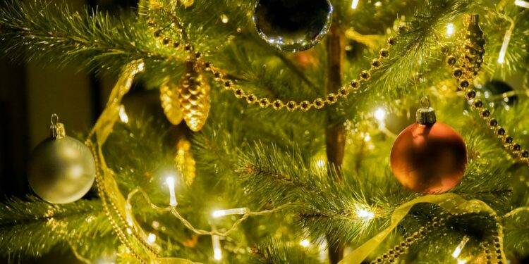 gold and silver baubles on green christmas tree