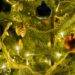gold and silver baubles on green christmas tree