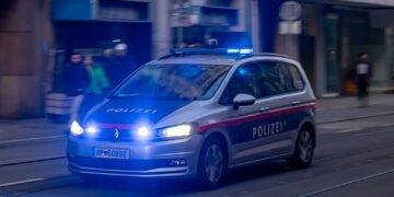 a police car driving down a city street
