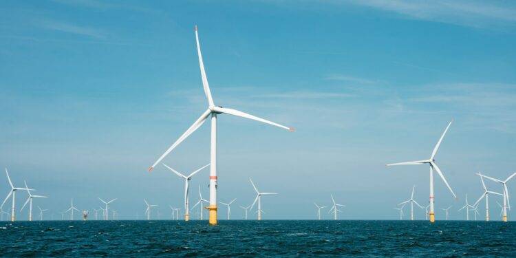 a group of wind turbines in the ocean