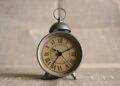 turned on gray alarm clock displaying 10:11
