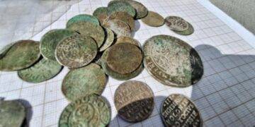 Treasure Trove of 400-Year-Old Coins Unearthed in Western Poland