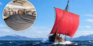 Gdańsk sailmakers working on black sails alongside Draken Harald Hårfagre under a red sail
