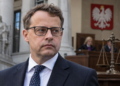 Editorial image of former Polish deputy justice minister Marcin Romanowski with a Polish court setting