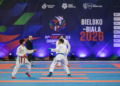 Two karate competitors spar at the 2026 World Cadet, Junior and Under-21 Championships in Bielsko-Biała.