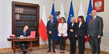 Polish judge-elect takes oath without president but is blocked from hearing cases