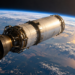 Digitally created concept illustration of a spent rocket stage in orbit above Earth, not a documentary photograph of the Chinese ZQ-2E stage.