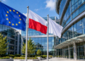 Digital illustration of EU and Polish flags flying outside a modern glass institutional building. This does not depict the actual Frontex headquarters in Warsaw.