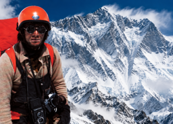 Editorial composite using an authentic photograph of Jerzy Kukuczka with an AI-generated Himalayan mountain background inspired by Lhotse