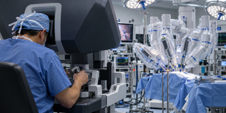 Digital illustration of a surgeon using a robotic surgical console while covered robotic arms stand in a modern operating theatre.
