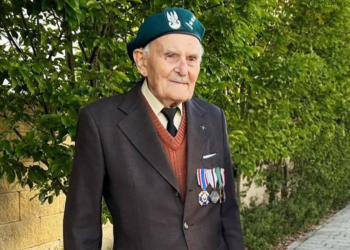 Marian Drożdż, veteran of Poland's 1939 campaign, pictured in a jacket with military decorations and a veterans' beret