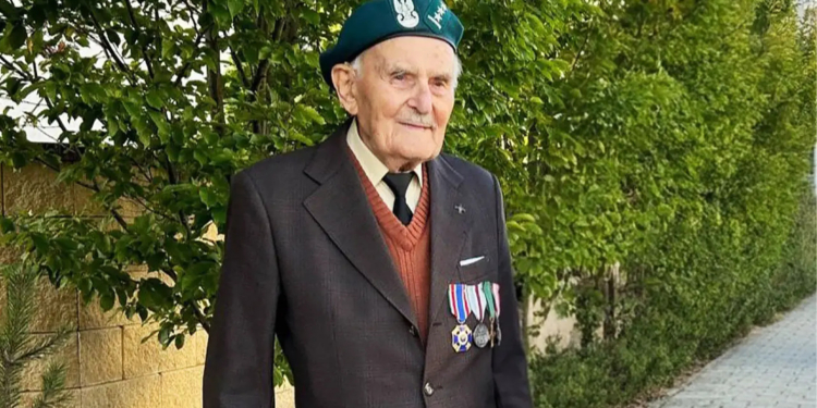 Marian Drożdż, veteran of Poland's 1939 campaign, pictured in a jacket with military decorations and a veterans' beret