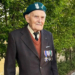 Marian Drożdż, veteran of Poland's 1939 campaign, pictured in a jacket with military decorations and a veterans' beret