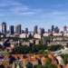 Red aircraft flying above the Warsaw skyline in Microsoft Flight Simulator World Update 23