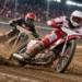 Digitally generated illustration of two anonymous speedway riders leaning into a turn on a dirt oval, with flying dirt and floodlit stands; not an actual race photograph