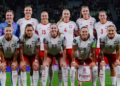 Poland women's football team pose on a football pitch; Ewa Pajor stands in the front row wearing number 9. Photo source: Ewa Pajor / Instagram.