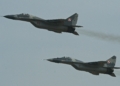 Two Polish Air Force MiG-29 fighters flying in formation at the 2013 Royal International Air Tattoo