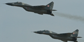 Two Polish Air Force MiG-29 fighters flying in formation at the 2013 Royal International Air Tattoo