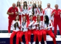 Group of Polish women's U17 boxing competitors and coaches in red-and-white team kit at the European Championships in Budva, Montenegro