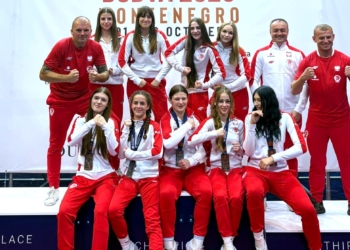 Group of Polish women's U17 boxing competitors and coaches in red-and-white team kit at the European Championships in Budva, Montenegro