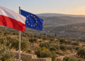 Digitally created illustration of Polish and European Union flags overlooking an olive grove; not a photograph of the West Bank incident.