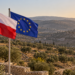 Digitally created illustration of Polish and European Union flags overlooking an olive grove; not a photograph of the West Bank incident.