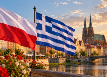 Digitally created illustration of Polish and Greek national flags above a fictionalised historic European riverside town; not a photograph of an actual ceremony.