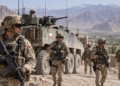 Digital editorial illustration of Polish soldiers and a Rosomak-style armoured vehicle in Afghanistan; not a documentary photograph of a specific patrol.
