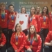 Polish university chess and bridge medal winners wearing red Poland team tracksuits and displaying their medals at the 2026 FISU championship in China.