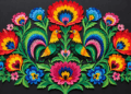 Illustrative colourful Polish wycinanki paper-cut folk art with symmetrical flowers and birds