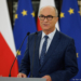 Włodzimierz Czarzasty speaking at a lectern in front of Polish and European Union flags. Archive photo credited to Piotr Molecki / Kancelaria Sejmu.