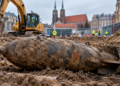 Digitally created editorial illustration of an unexploded wartime aerial bomb at a modern construction site; not an actual photograph of the Wrocław bomb.