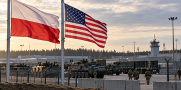 Illustrative image of Polish and US flags at a military installation