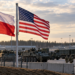 Illustrative image of Polish and US flags at a military installation