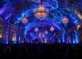 AI-generated editorial illustration of a jazz ensemble performing in an underground salt chamber illuminated with blue lighting and chandeliers, with an audience in the foreground