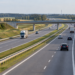 Digitally generated illustration of a motorway in Poland with ordinary traffic and an overpass; not a photograph of the A1 crash.