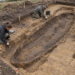 Illustrative archaeological excavation of a boat-shaped grave