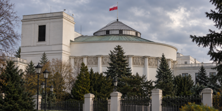 Digitally created architectural illustration of the Polish Sejm parliament building in Warsaw beneath an overcast sky, with the Polish flag flying