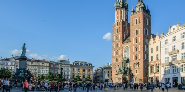 Kraków's Main Market Square with St Mary's Basilica and the Adam Mickiewicz monument, in a photograph supplied by the editor