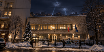 Digitally created night view based on the Polish Embassy in Kyiv, with distant air-defence searchlights over the city