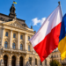Digitally created illustration of Polish and Ukrainian flags in front of a historic-style civic building; not documentary photography.