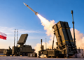 Digitally generated illustration of a missile launching from an air-defence launcher with a Polish flag in the foreground; not a real Narew launch.
