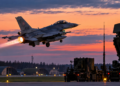 Digitally created illustration of a Polish fighter jet near air-defence equipment at an airbase