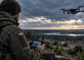Digitally created illustration of a drone operator wearing a Polish flag patch controlling a quadcopter in a rural landscape; not an image of an operational Drone Legion unit or Blue Eye exercise.